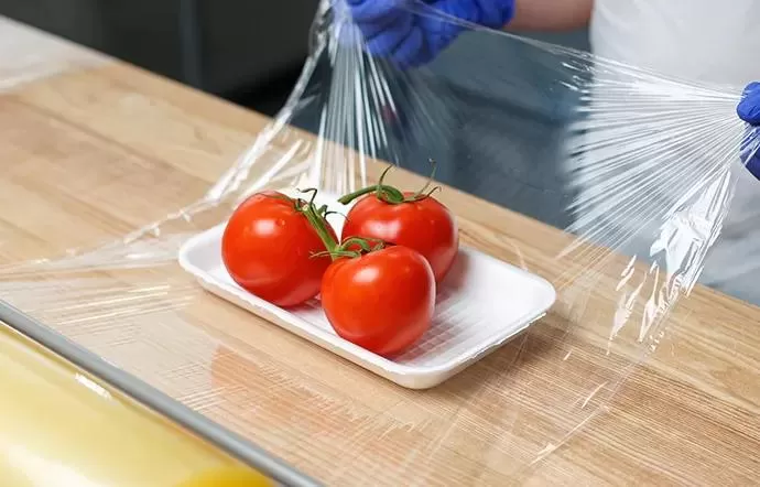 Plastic-Wrap-Preserving-Tomatoes-in-White-Plate.jpg Plastic-Wrap-Preserving-Tomatoes-in-White-Plate.jpg